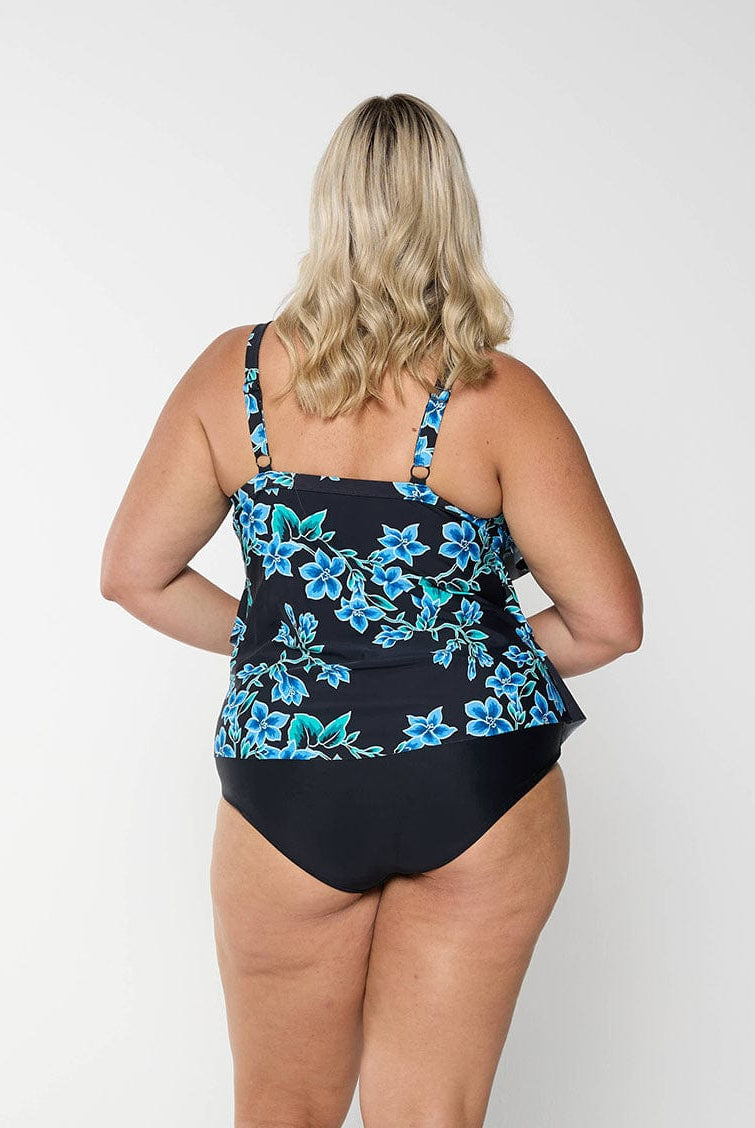 Model showing the back of a blue floral tankini top with adjustable straps