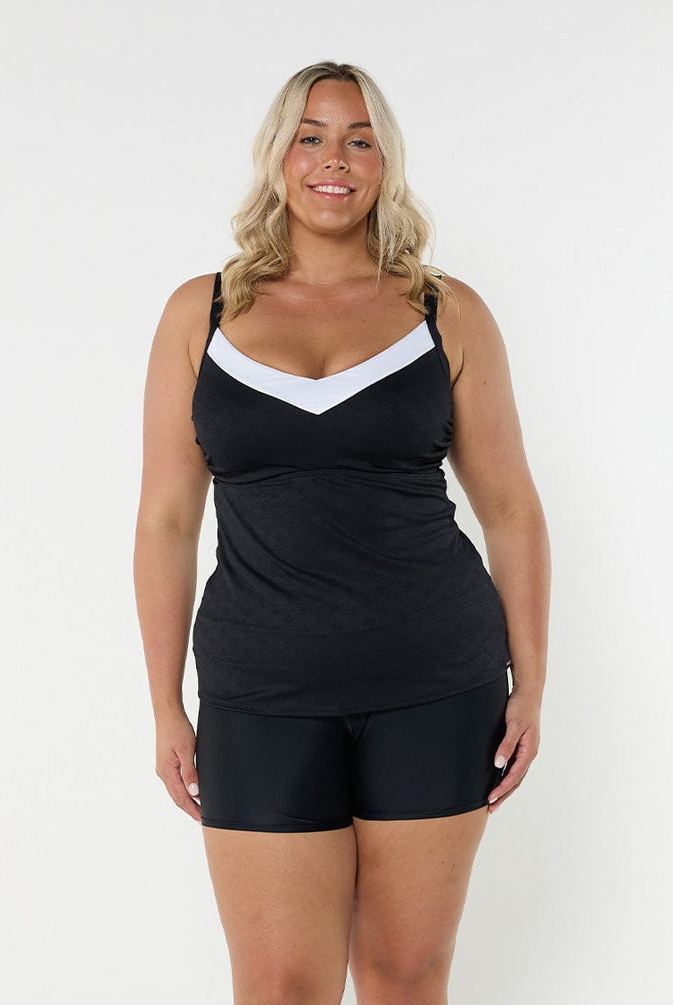 Blonde model wearing black textured underwire tankini