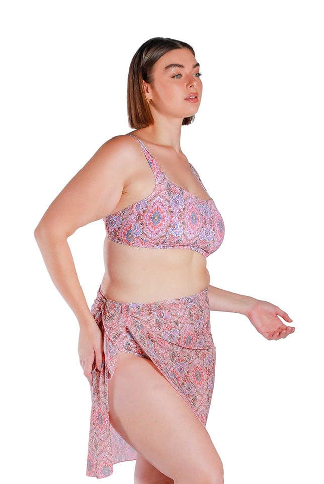 Model wearing pink printed long tie side mesh swimming skirt