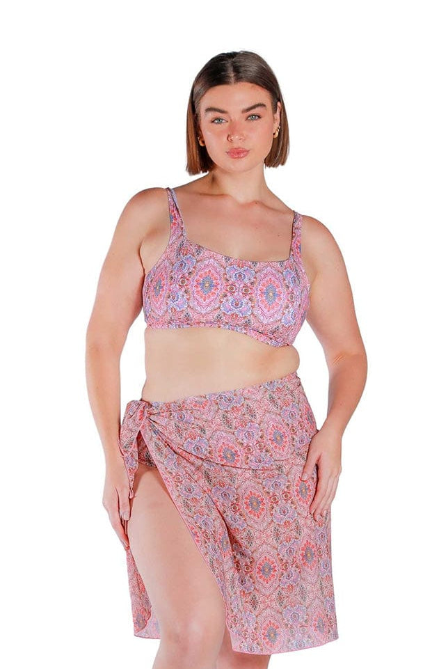 Model wearing pink printed long tie side mesh swimming skirt