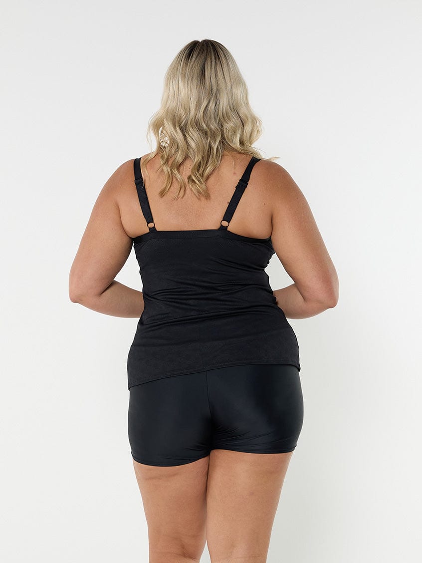 Back of blonde model in studio wearing textured underwire tankini top