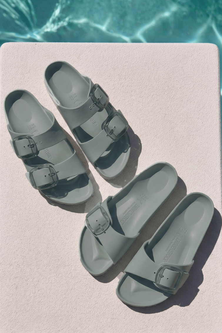Birkenstock sandals by pool with big buckle detail