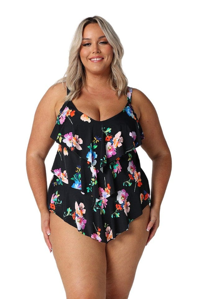 Model wearing black with bright florals ruffle tankini