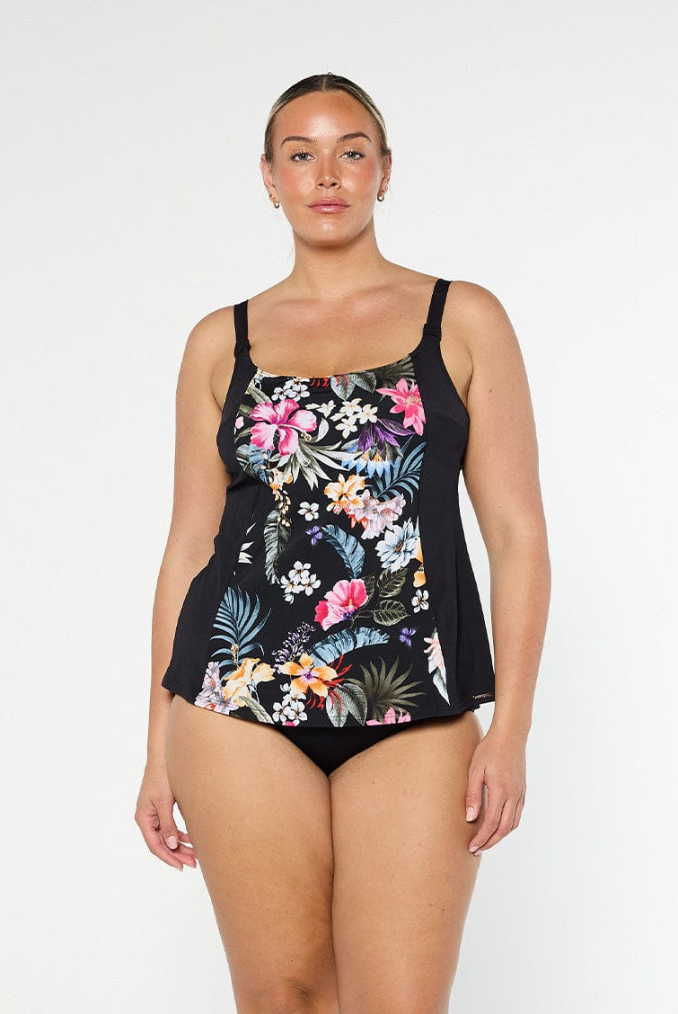 Blonde model shows the front of chlorine resistant floral tankini top with shelf bra and adjustable straps