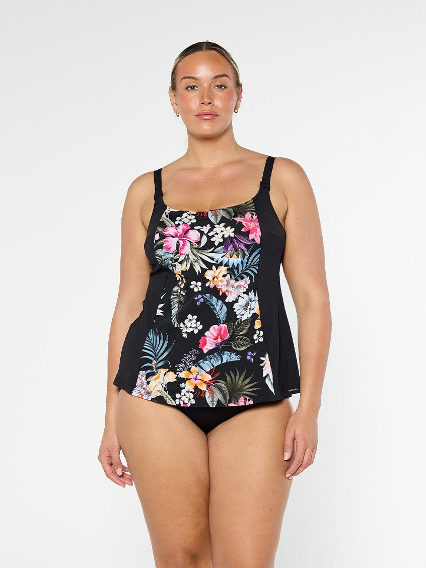 Blonde model shows the front of chlorine resistant floral tankini top with shelf bra and adjustable straps