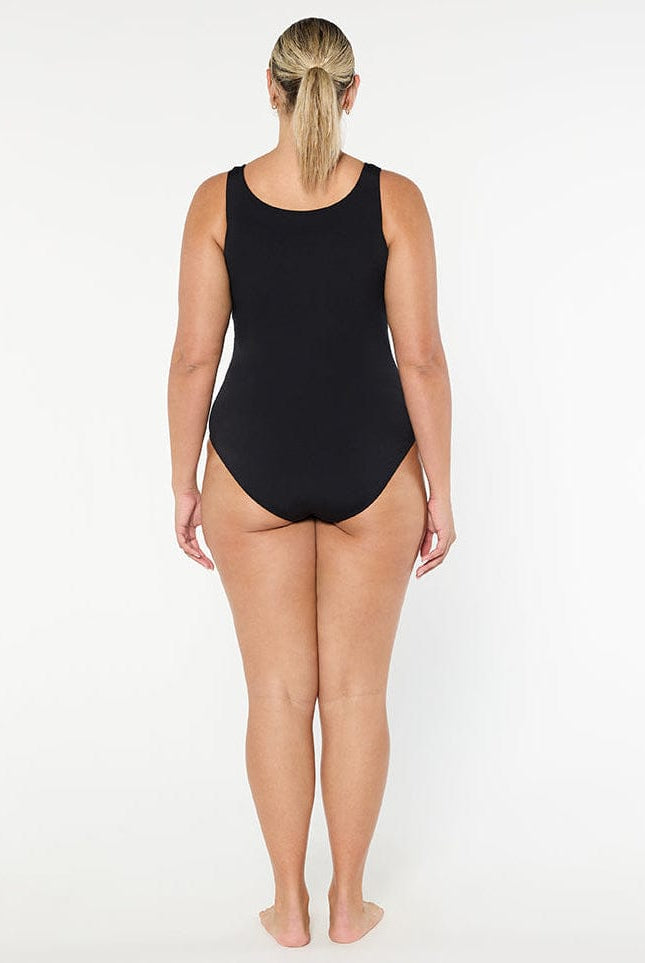 Person wearing a black swimsuit on a white background