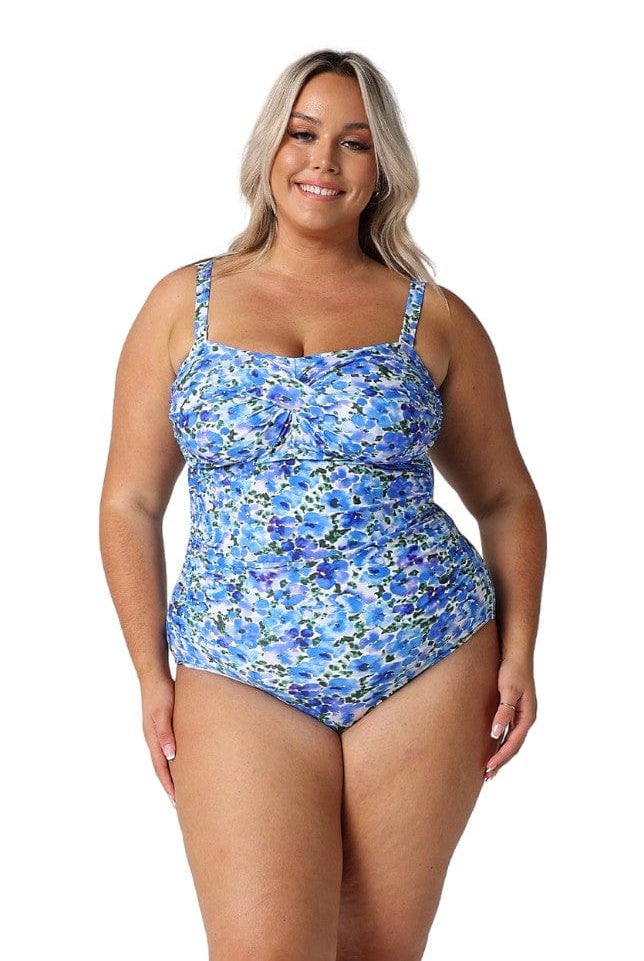 Model wearing blue floral one piece swimsuit