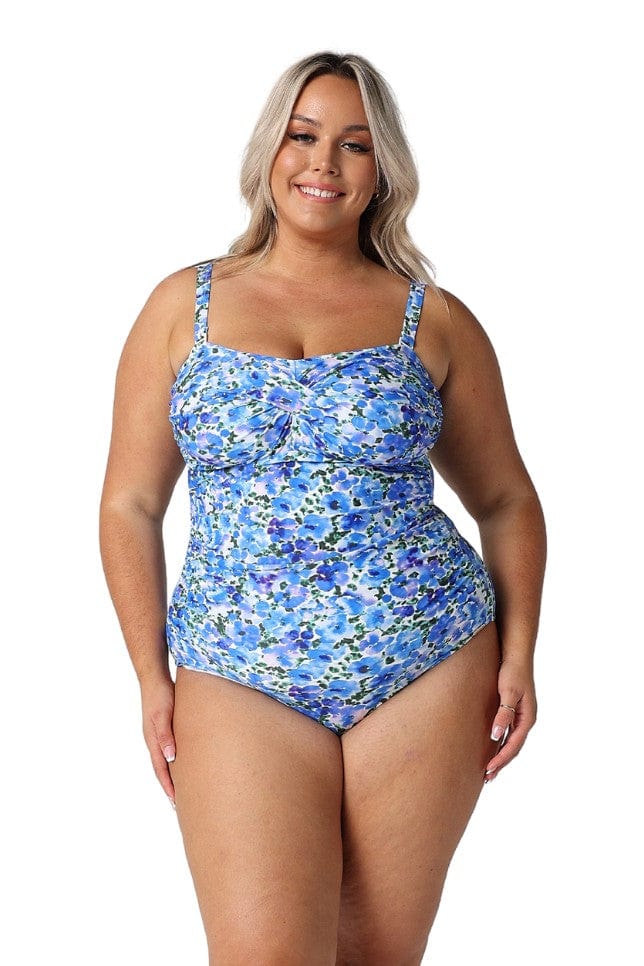 Model wearing blue floral one piece swimsuit