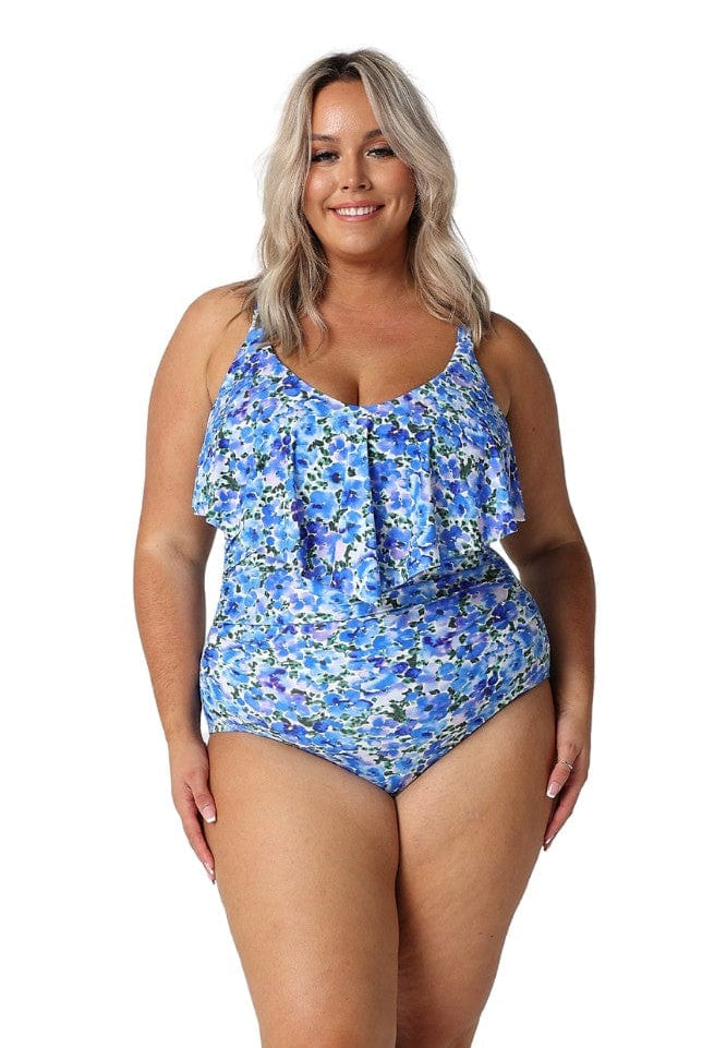 Model wearing blue floral one piece with long frill