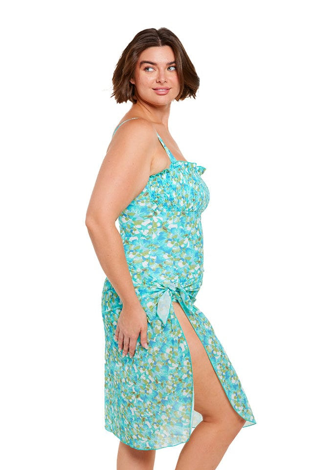 Brunette plus size model wears turquoise blue long mesh wrap beach sarong