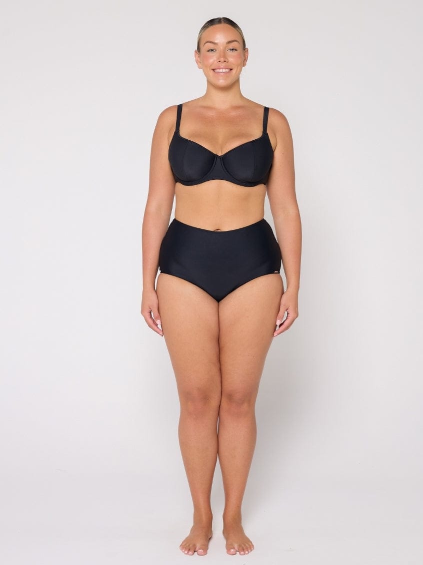 Woman wearing a black bikini set on a white background