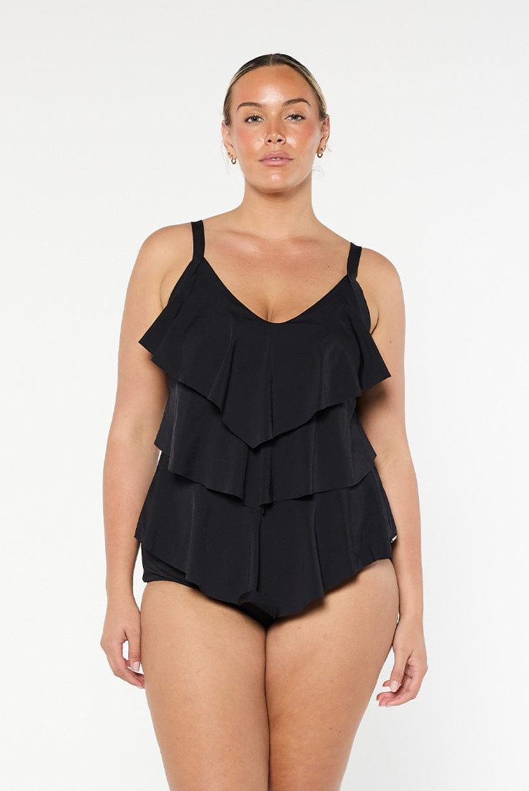 Blonde model wears black chlorine resistant tankini top