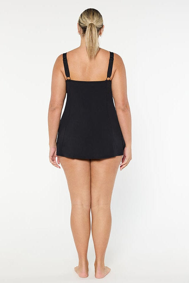 Person wearing a black swimsuit on a white background