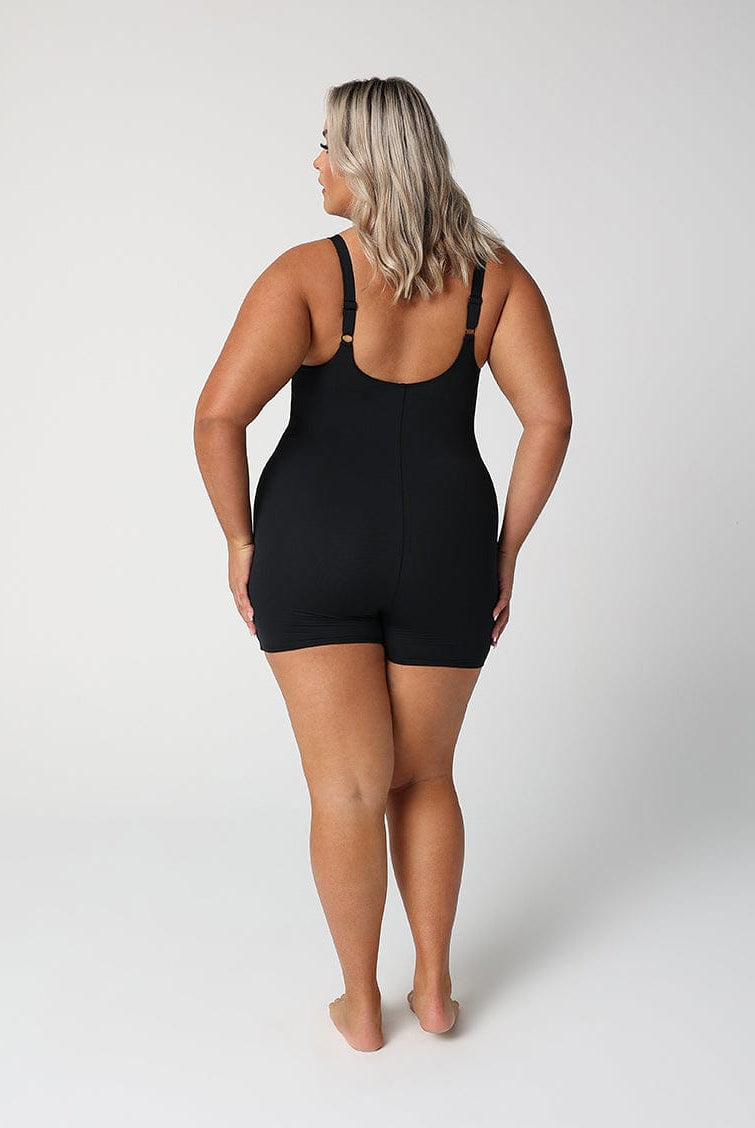 back of model wearing black boyleg one piece