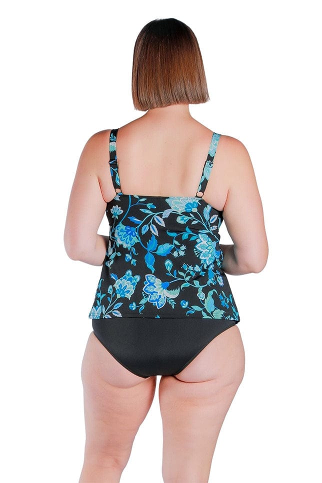back shot of brunette woman wearing a turquoise floral tankini top in chlorine resistant fabric