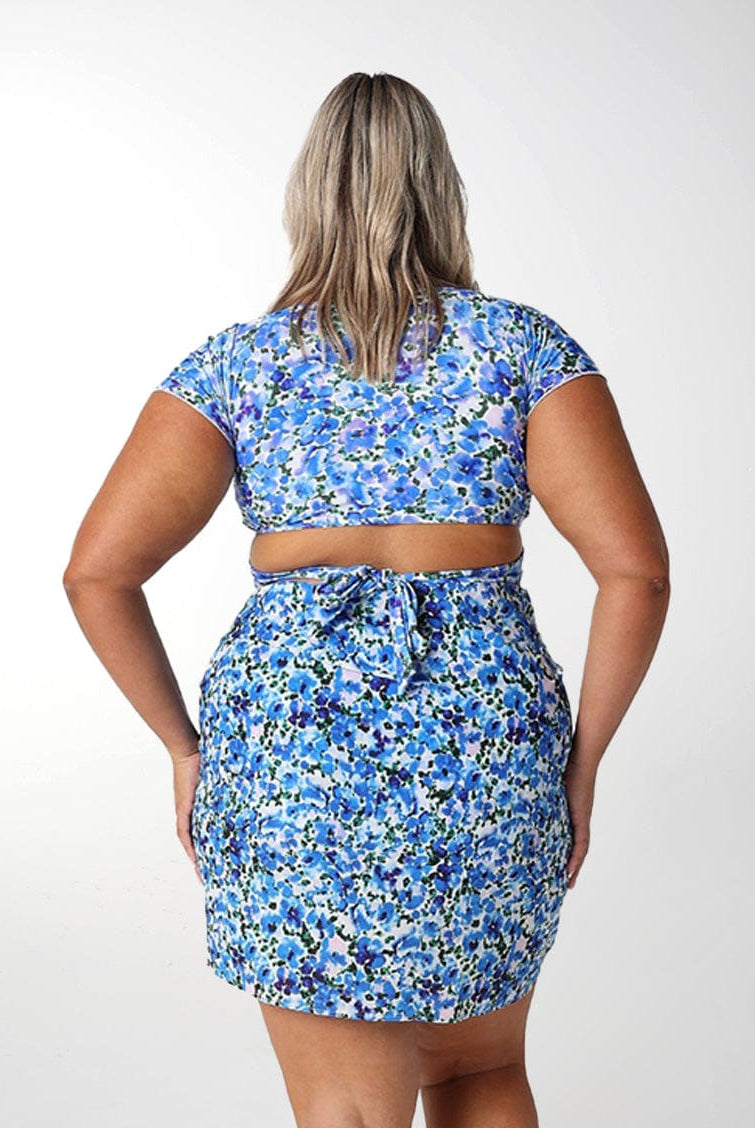 Model showing back of blue floral short sarong