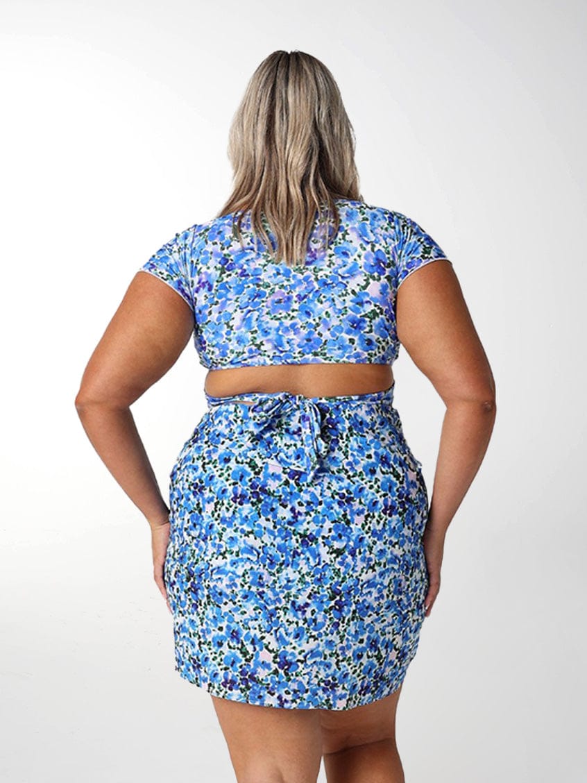 Model showing back of blue floral short sarong