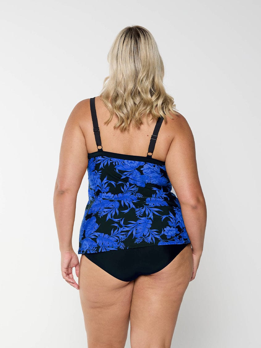 model showing back of blue and black floral underwire tankini with adjustable straps