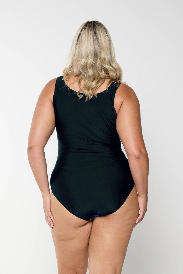 model showing back of blue and black high neck one piece