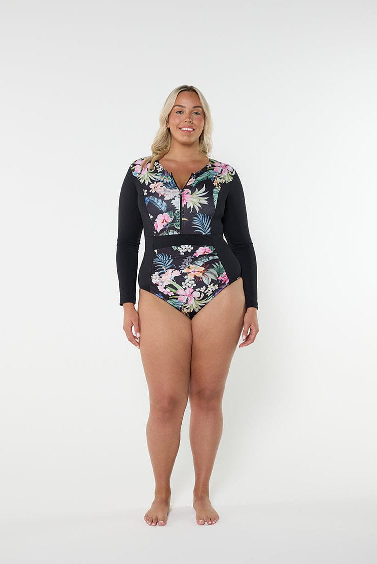 Woman wearing a black floral swimsuit with a hood on a white background
