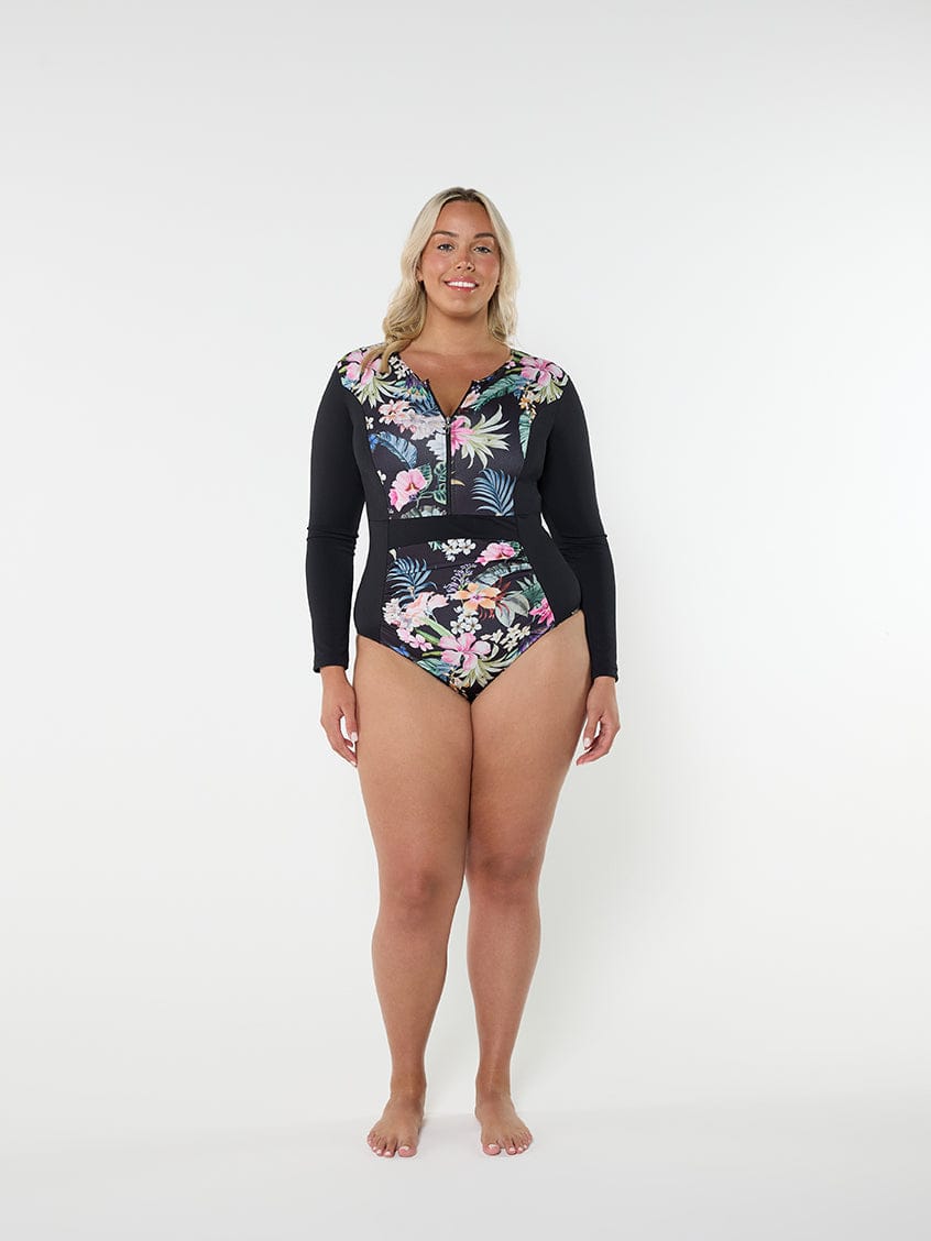 Woman wearing a black floral swimsuit with a hood on a white background