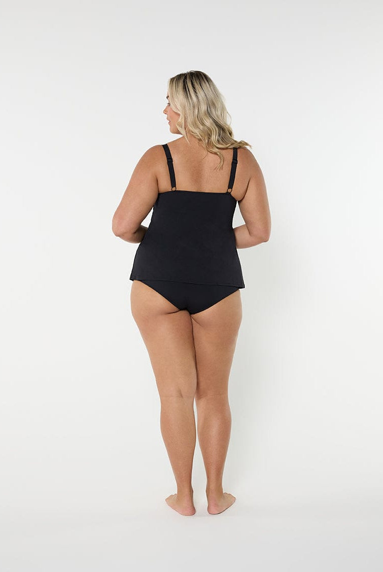 Woman wearing a black swimsuit on a white background