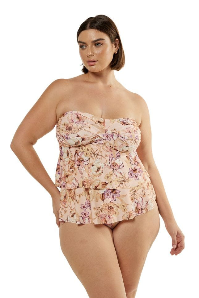 Brunette model wearing tiered tankini swim top