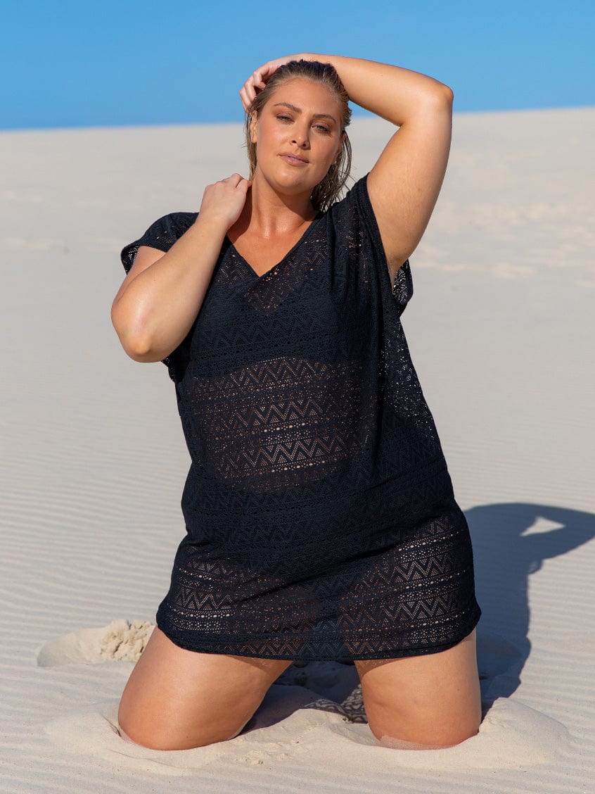 Model on beach wearing short sleeve textured coverup dress