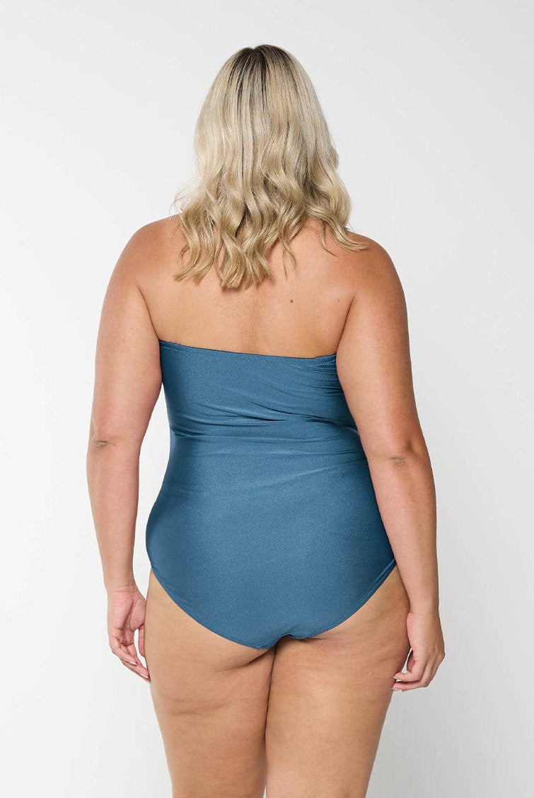 model showing back of shiny grey swimsuit