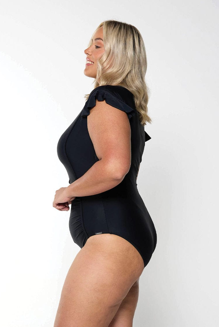 Model showing side of black frill sleeve one piece modest