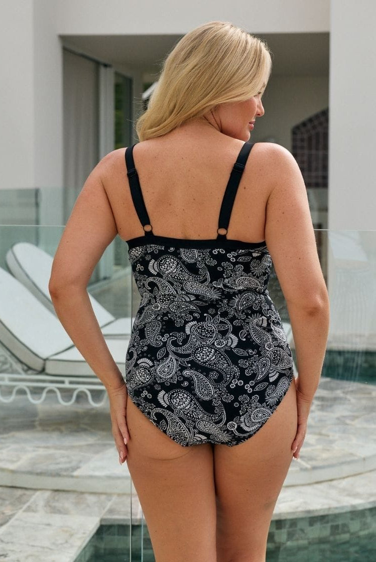 Blonde model facing back wearing a one piece with underwire support and adjustable straps in chlorine resistant fabric