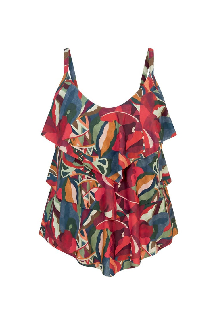A sleeveless ruffled tankini top with a vibrant abstract floral print in red, green, blue, and beige, displayed against a solid white background.