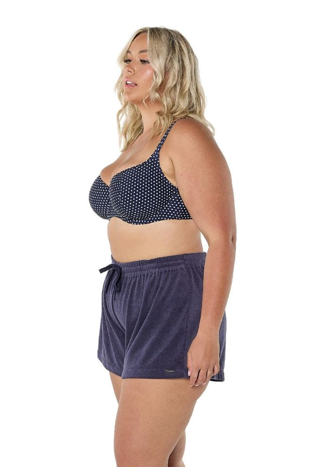 Model wearing navy terry towelling shorts