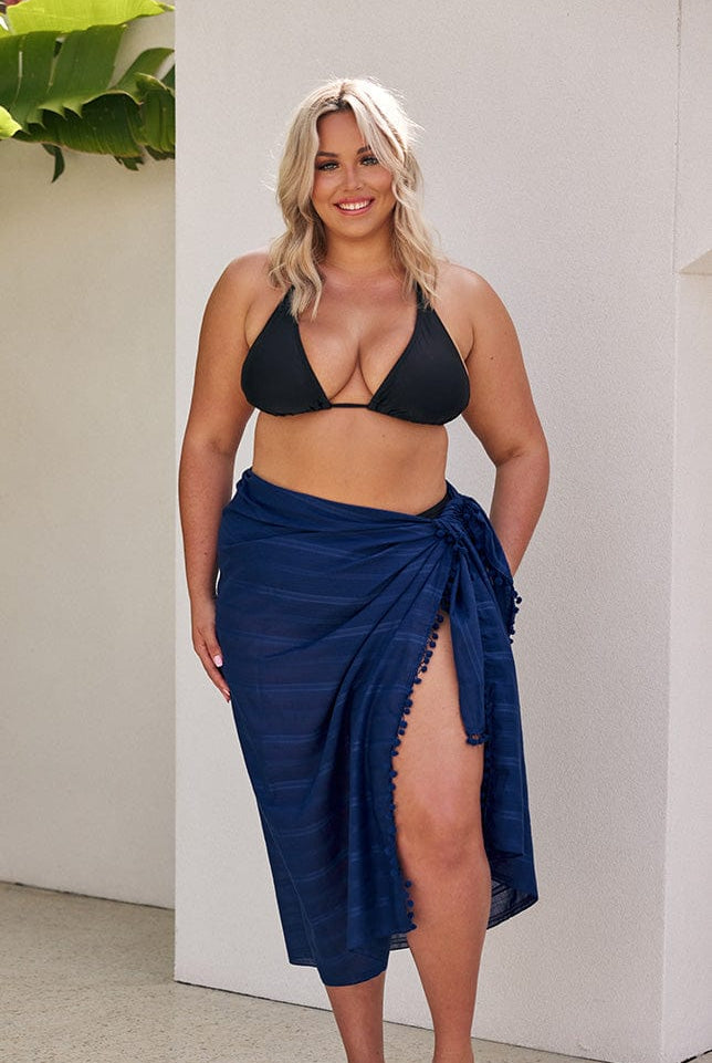 Blonde model wearing long navy sarong
