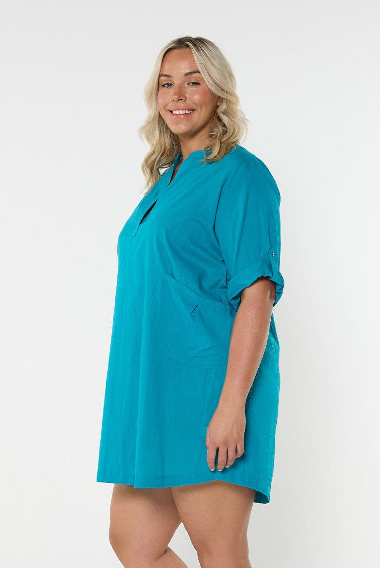 Model in studio wearing oversized coverup dress