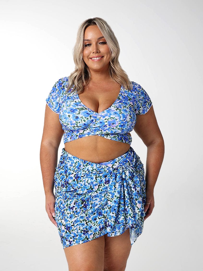 Front of model in studio wearing plus size floral sarong