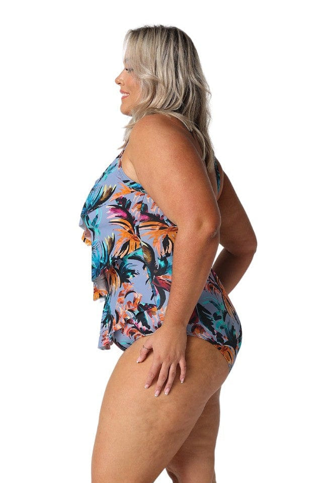 Model showing side of ruffled tropical print one piece