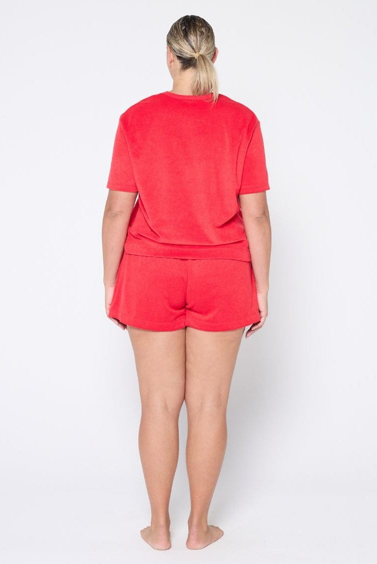 Person wearing a red outfit on a white background