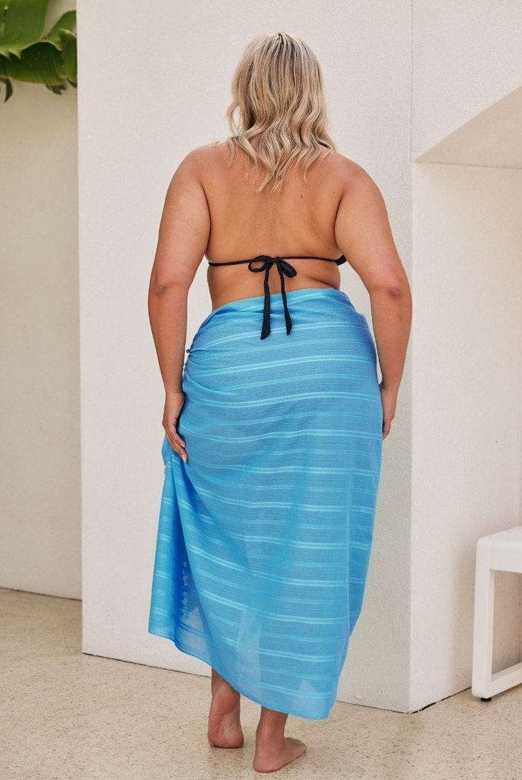 Back of model showing of sarong in blue