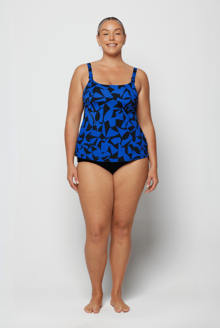 Woman wearing a blue camouflage swimsuit on a white background