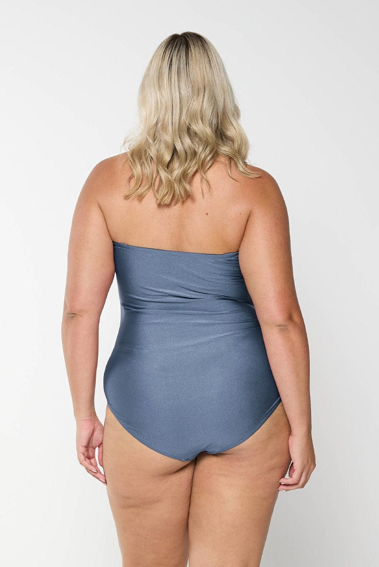 model showing back of shiny grey swimsuit