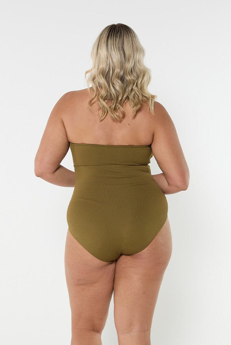 Blonde model wears strapless textured khaki one piece with full coverage bottom