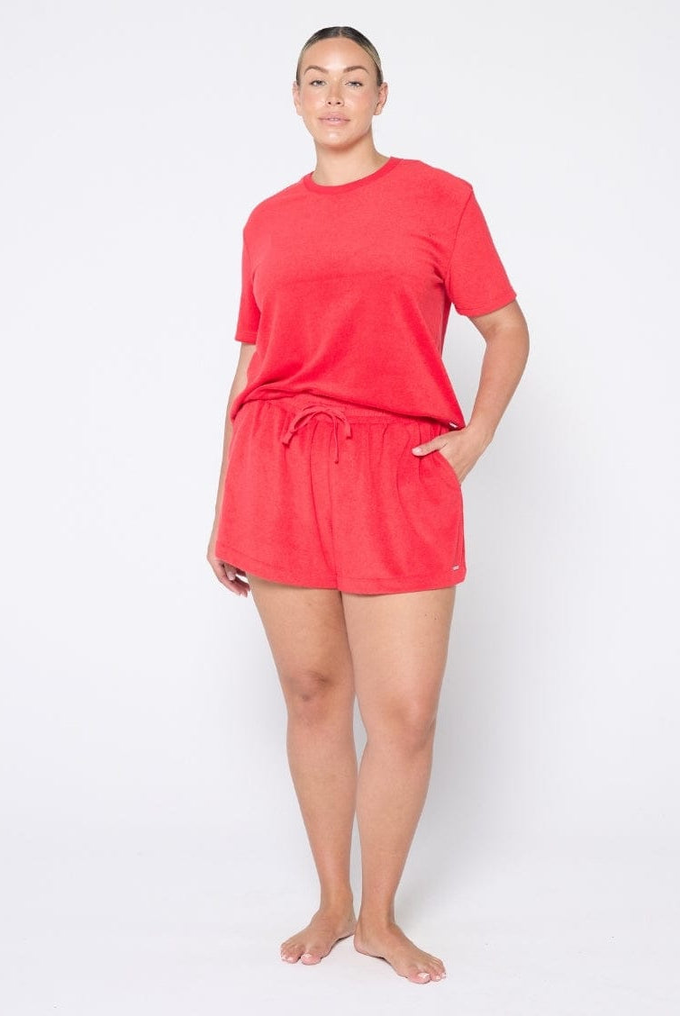 Person wearing a red outfit on a white background