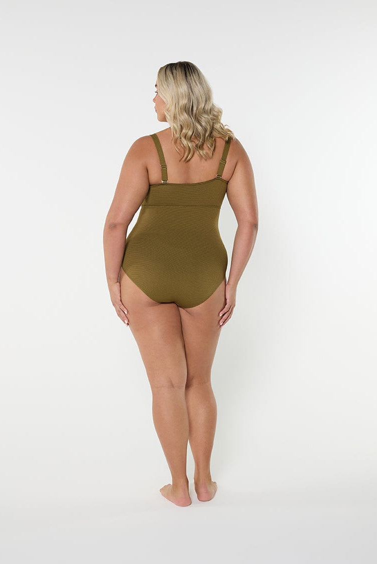 Person wearing a green swimsuit on a white background