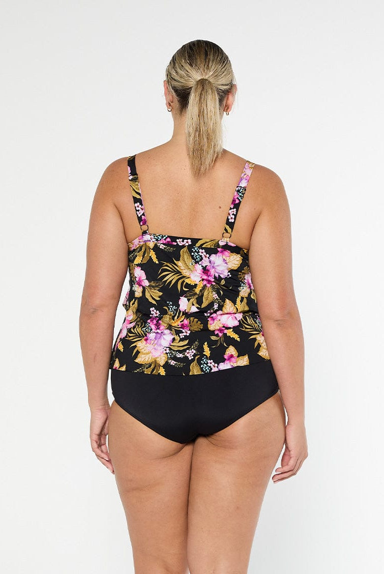 Blonde model shows the back of pink and gold floral chlorine resistant tankini top with adjustable straps