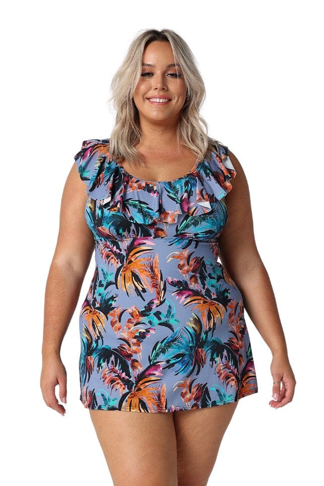 Model wearing blue tropical print swim dress