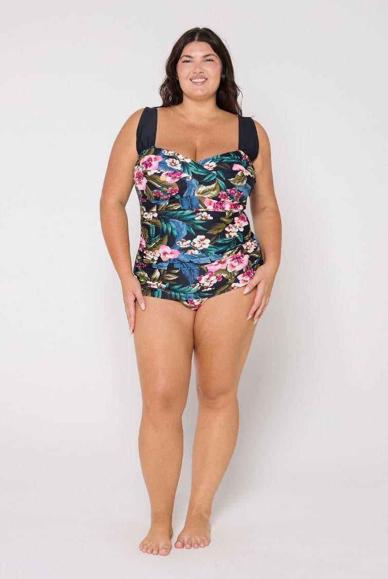 Woman wearing a retro floral swimsuit in the studio