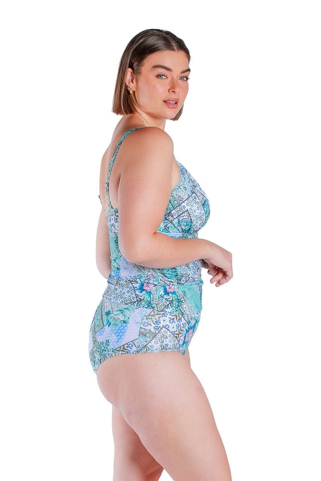 side profile of model wearing a underwire tankini top in blue and white print