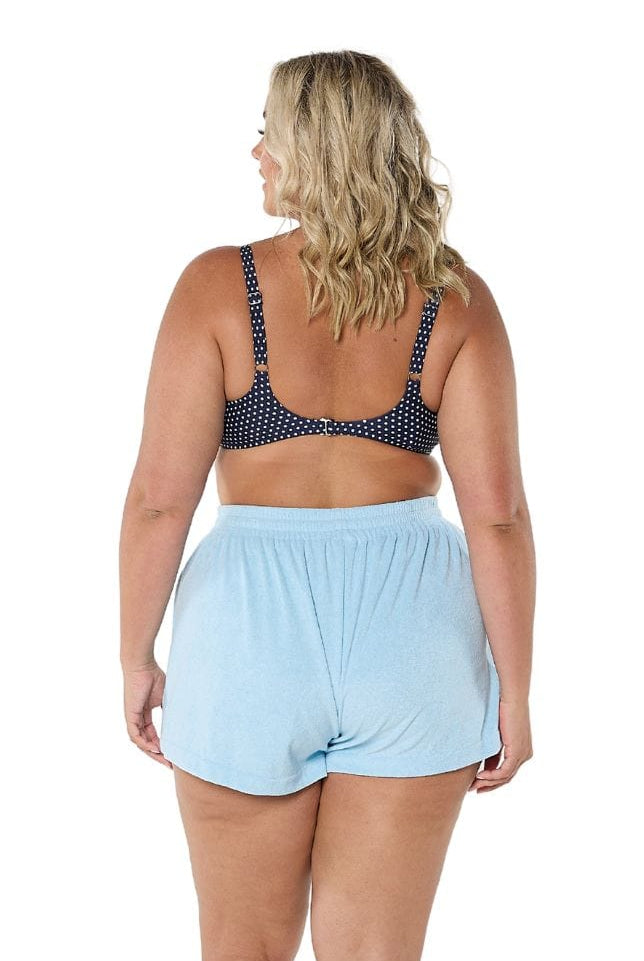 Model showing back of light blue terry towelling shorts