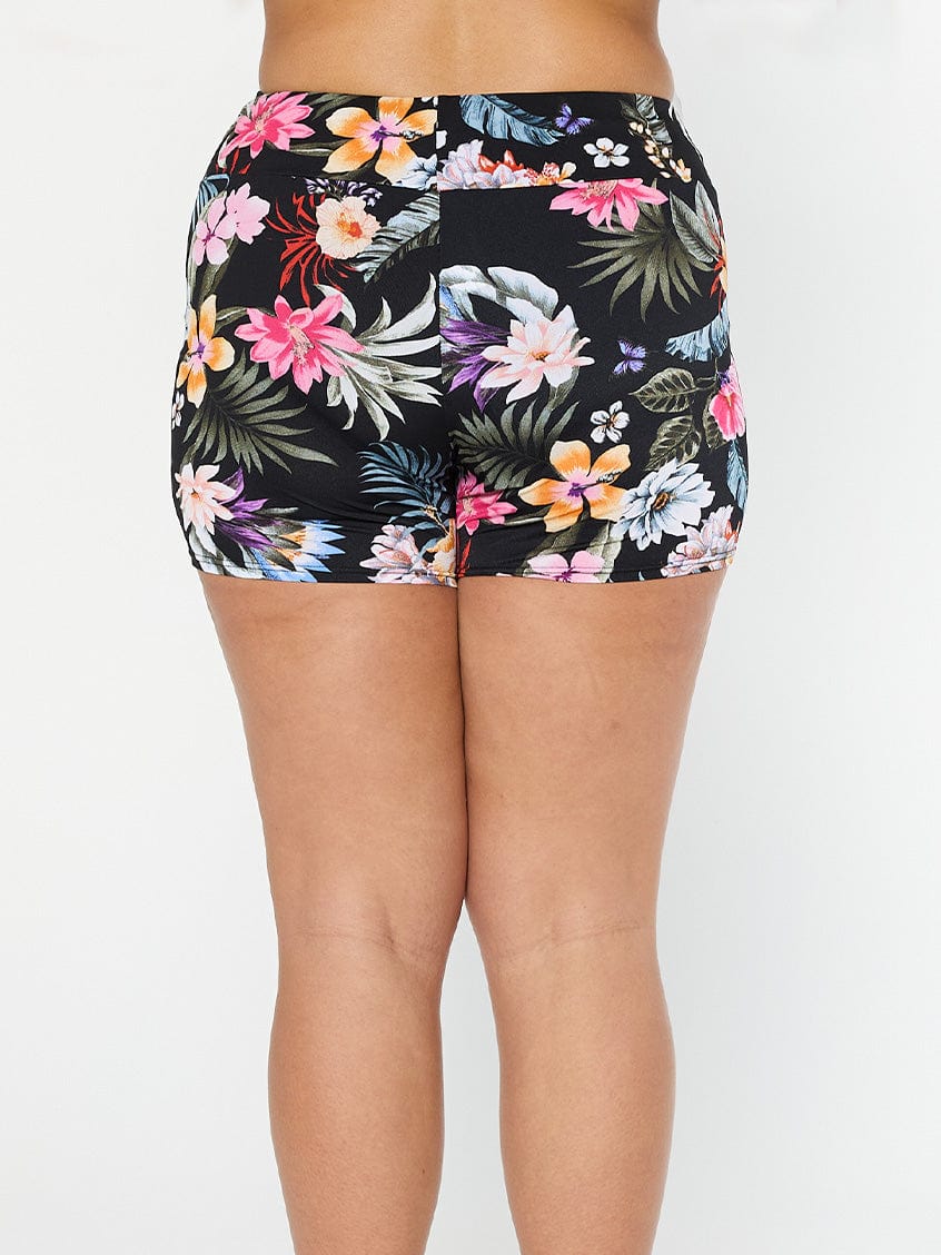 Model shows high waisted full coverage boyleg pants in black floral pool proof fabric